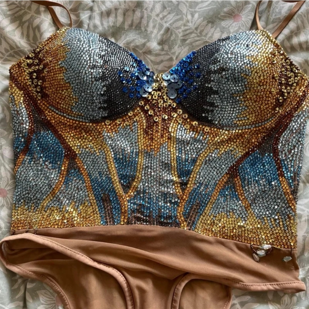 Handmade rhinestone bodysuit, gold sequin shorts, handmade blue tinsel jacket